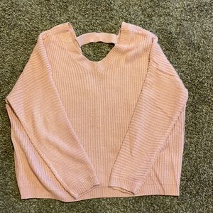 It’s off pink sweater size M